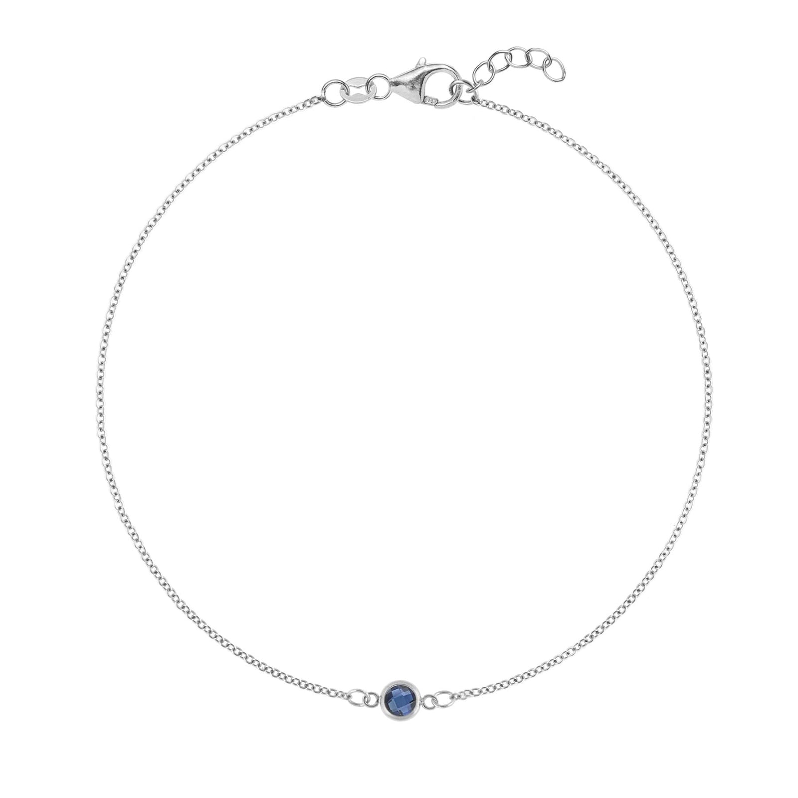 Classic cable chain bracelet featuring one 4 mm briolette cut sapphire bezel set in 14k white gold
