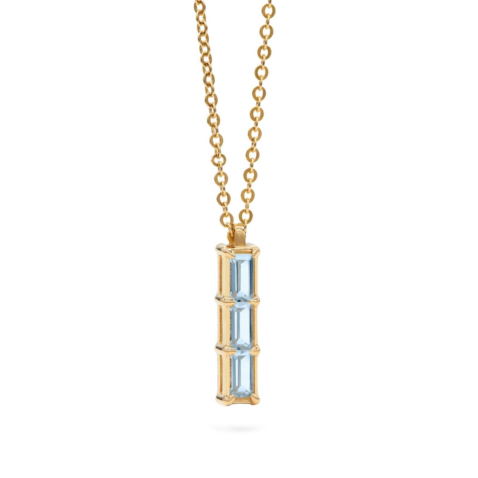 Providence Nantucket Blue Topaz vertical bar pendant featuring 3 petite baguette stones set in 14k yellow gold - angled view
