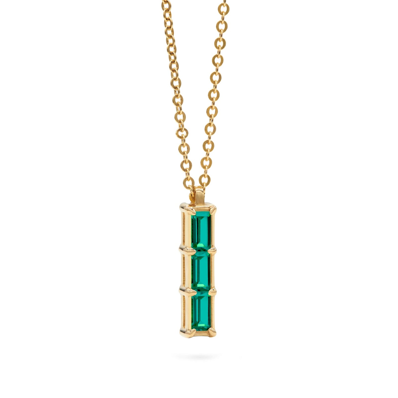 Providence Emerald vertical bar pendant featuring 3 petite baguette stones set in 14k yellow gold - angled view
