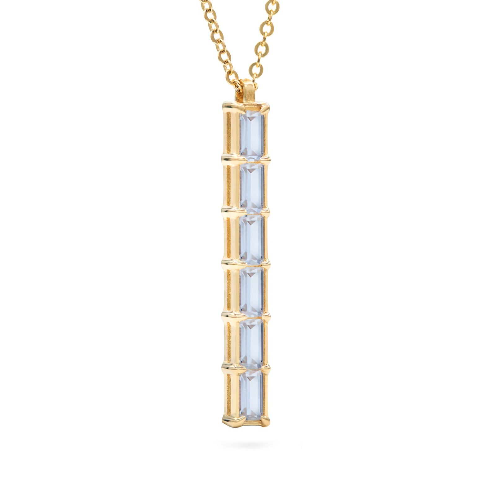 Providence vertical bar pendant featuring 6 petite Aquamarine baguette stones set in 14k yellow gold - angled view