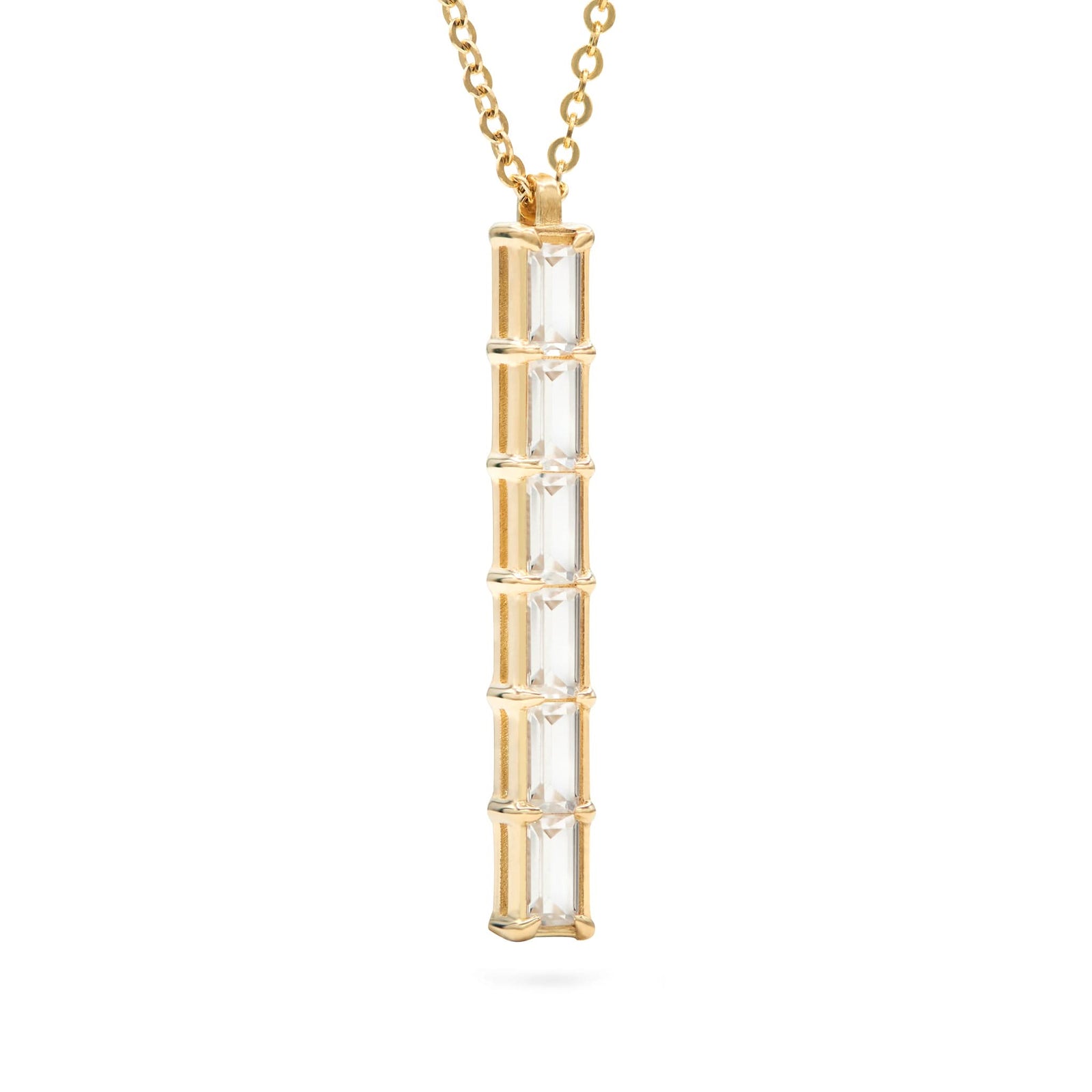 Providence vertical bar pendant featuring 6 petite White Topaz baguette stones set in 14k yellow gold - angled view