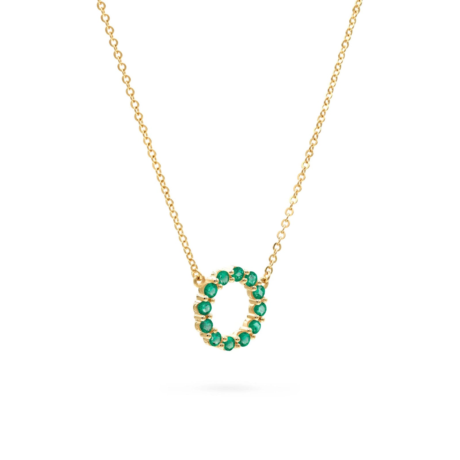 Rosecliff small circle necklace featuring twelve 2mm faceted round cut emeralds prong set in 14k yellow gold - angled view