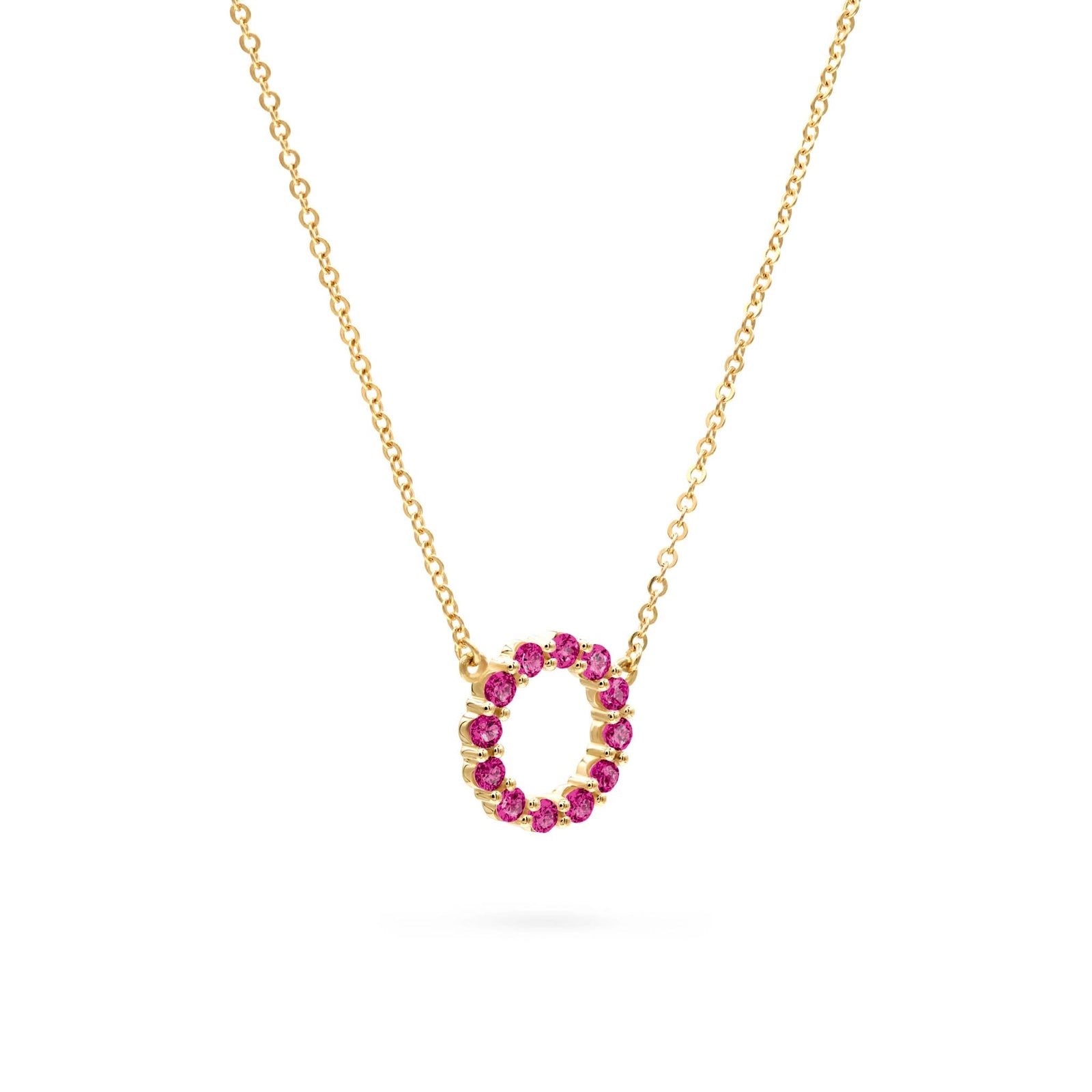Rosecliff small open circle necklace featuring twelve 2 mm round cut pink tourmalines prong set in 14k gold - angled view