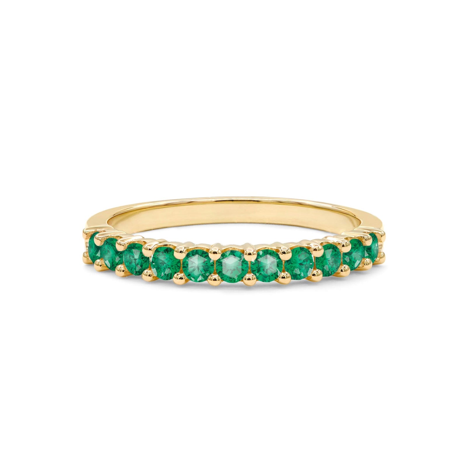 Rosecliff stackable ring featuring eleven 2 mm faceted round cut emeralds prong set in 14k yellow gold