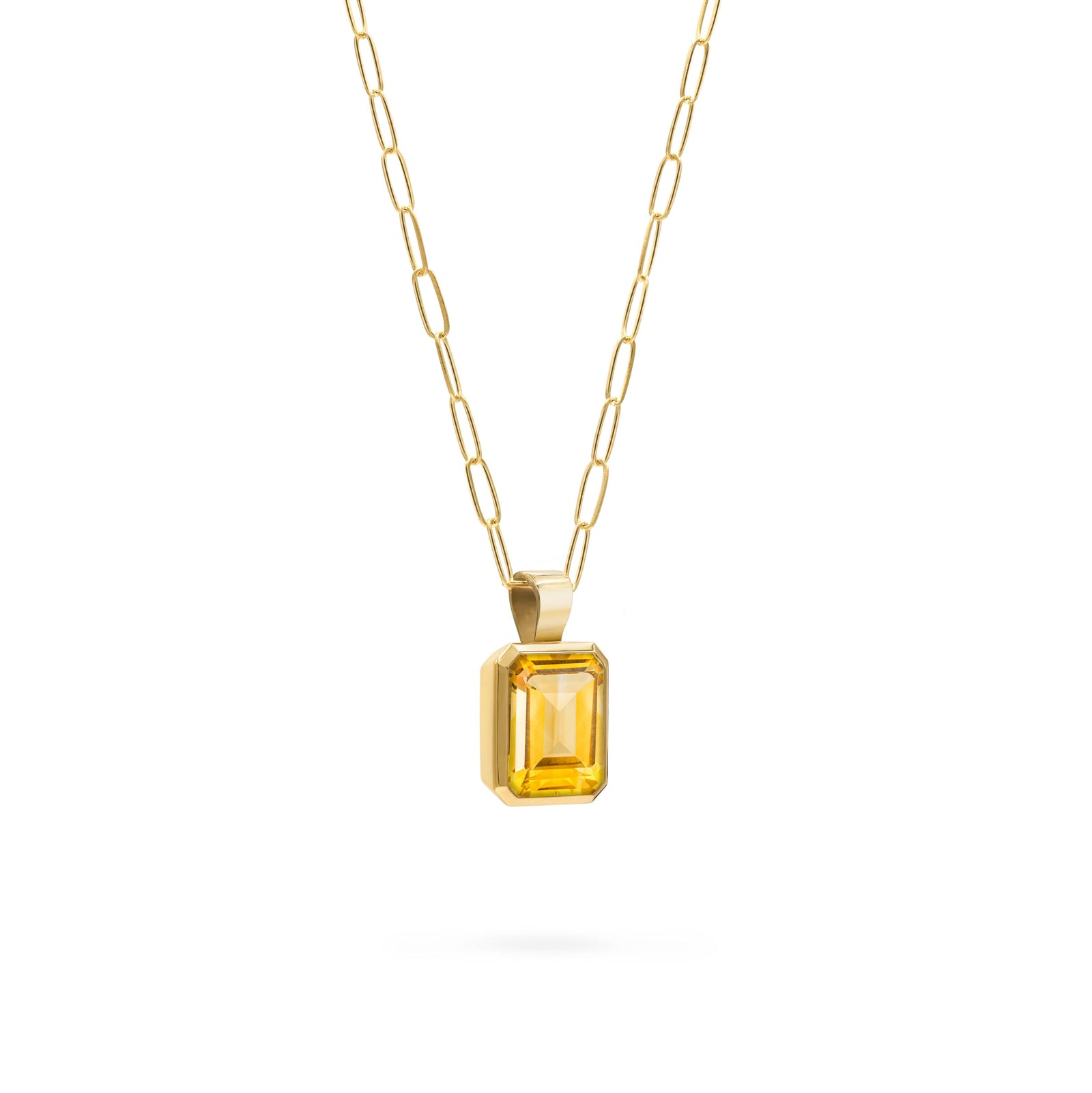 Adelaide paper clip chain and a Warren pendant with an emerald cut bezel set citrine gemstone in 14k gold - angled view