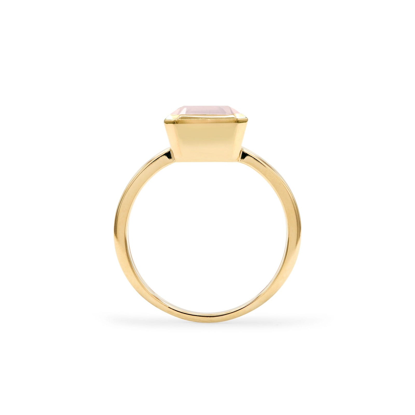 Warren ring in 14k yellow gold featuring one 10 x 8 mm emerald cut bezel set rose quartz - standing view