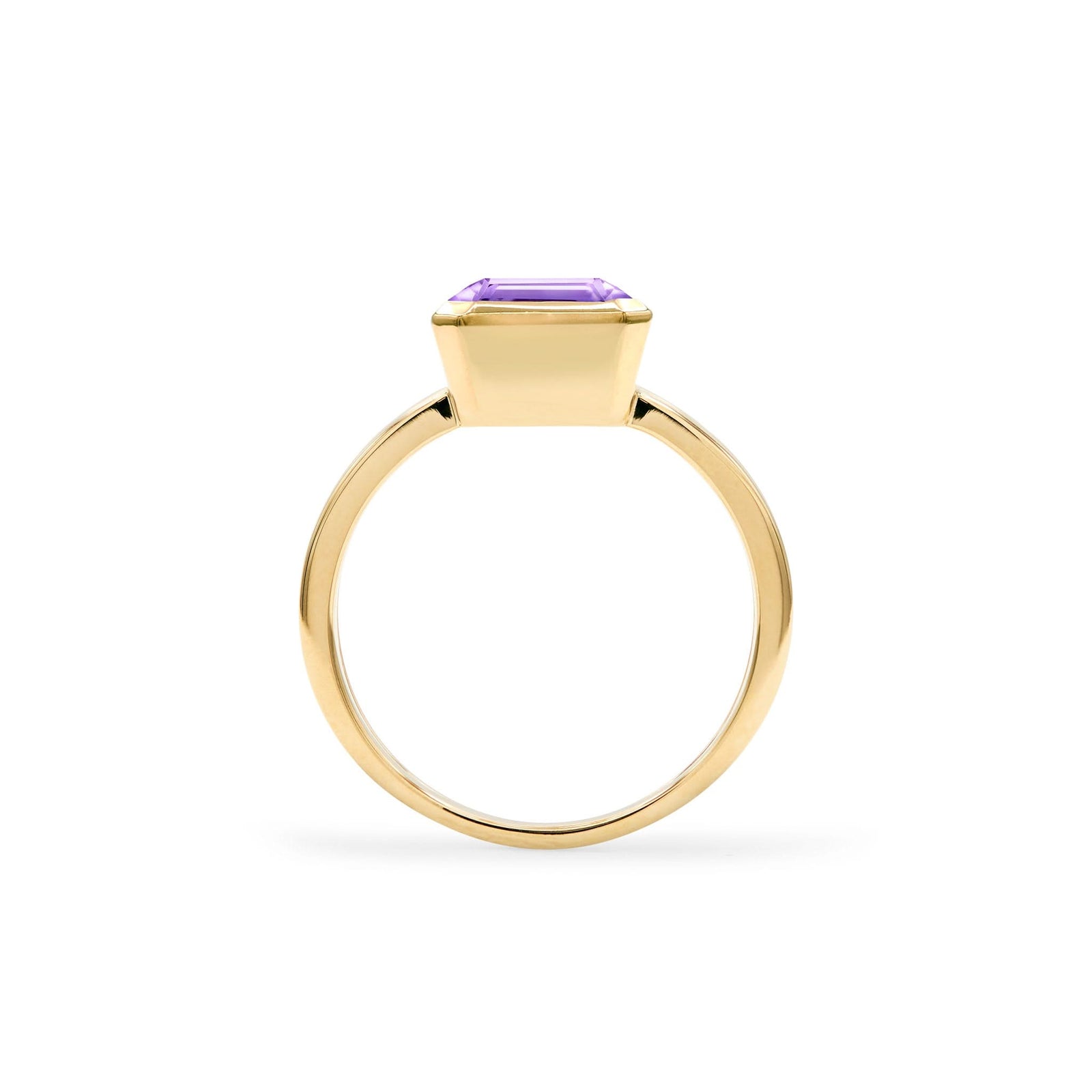 Warren ring in 14k yellow gold featuring one 10 x 8 mm emerald cut bezel set amethyst - standing view
