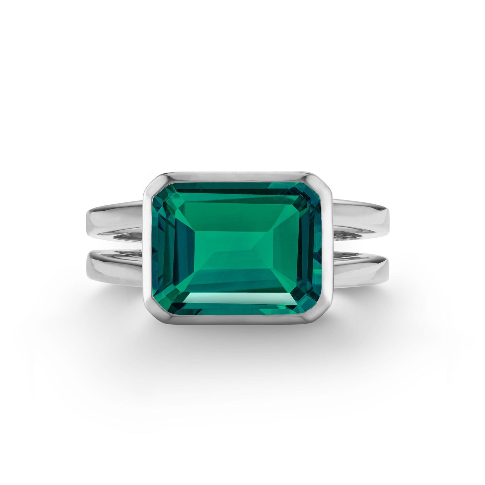 Warren Horizontal Emerald Ring, featuring an emerald-cut 8 x 10mm Emerald in 14k gold, hand-set horizontally in a 14k white gold bezel - front view.