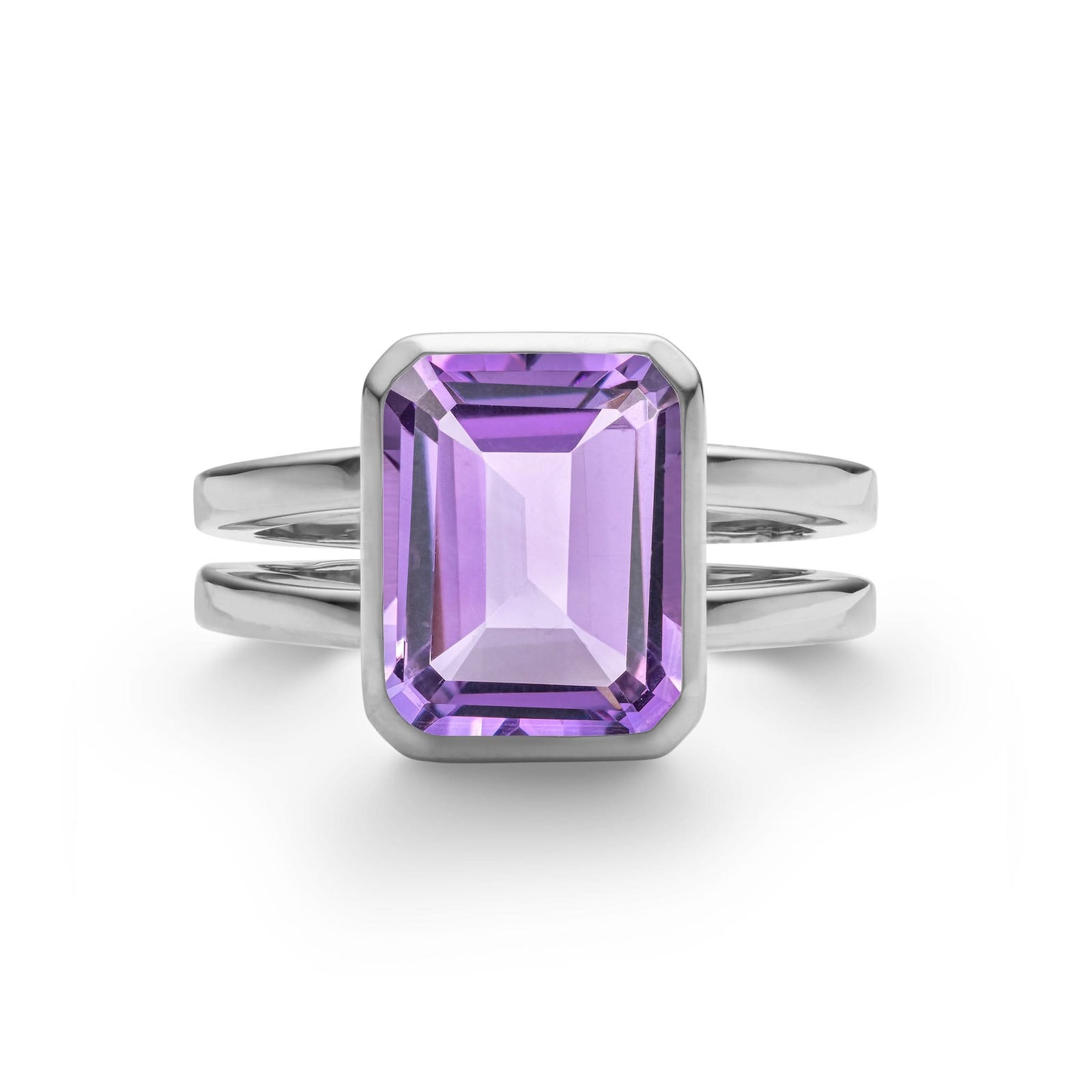 Warren ring in 14k white gold featuring one 10 x 8 mm emerald cut bezel set amethyst - front view