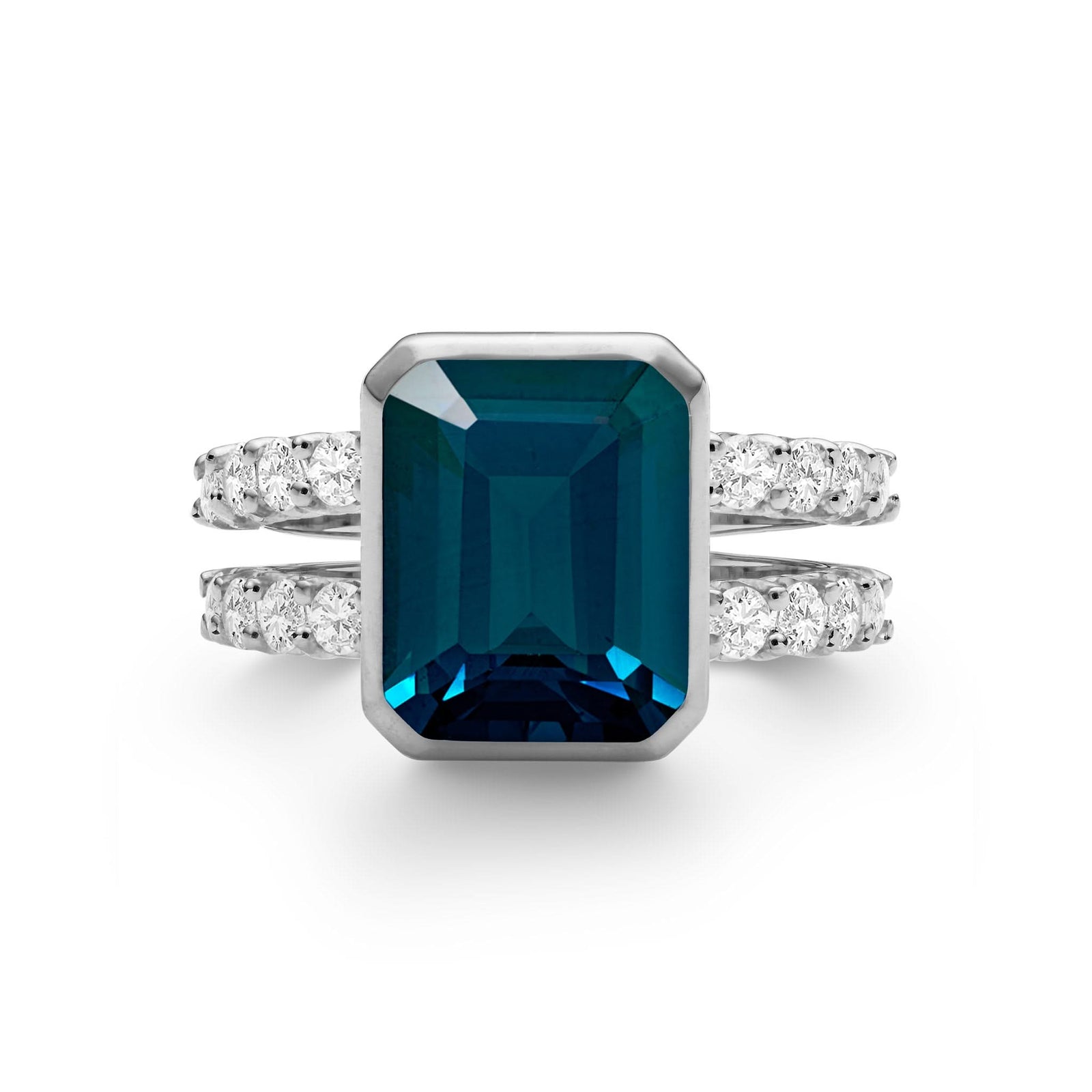Warren ring in 14k white gold with accent diamonds featuring one 10 x 8 mm emerald cut Atlantic Blue Topaz - aspect view