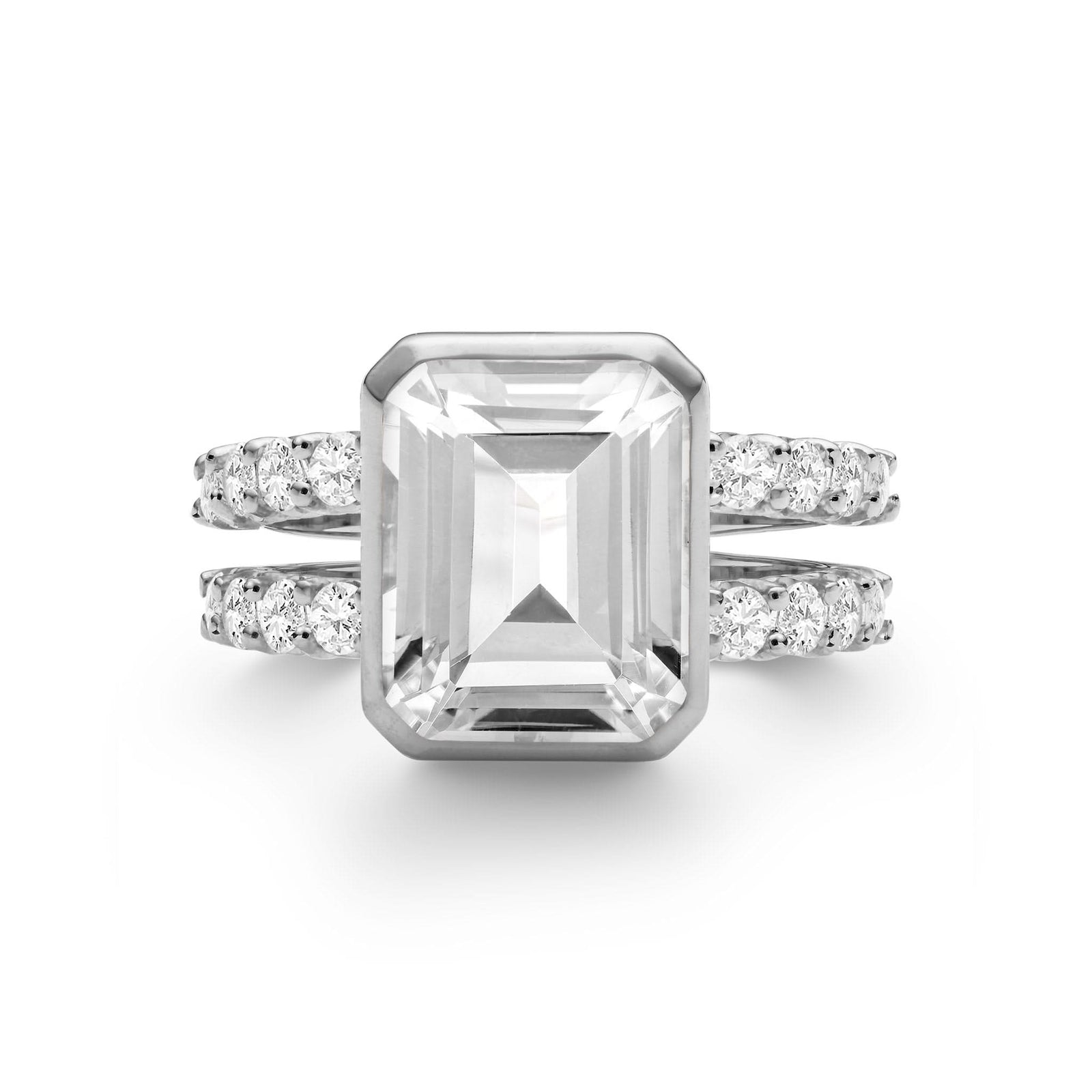 Warren ring in 14k white gold with accent diamonds featuring one 10 x 8 mm emerald cut bezel set white topaz - front view