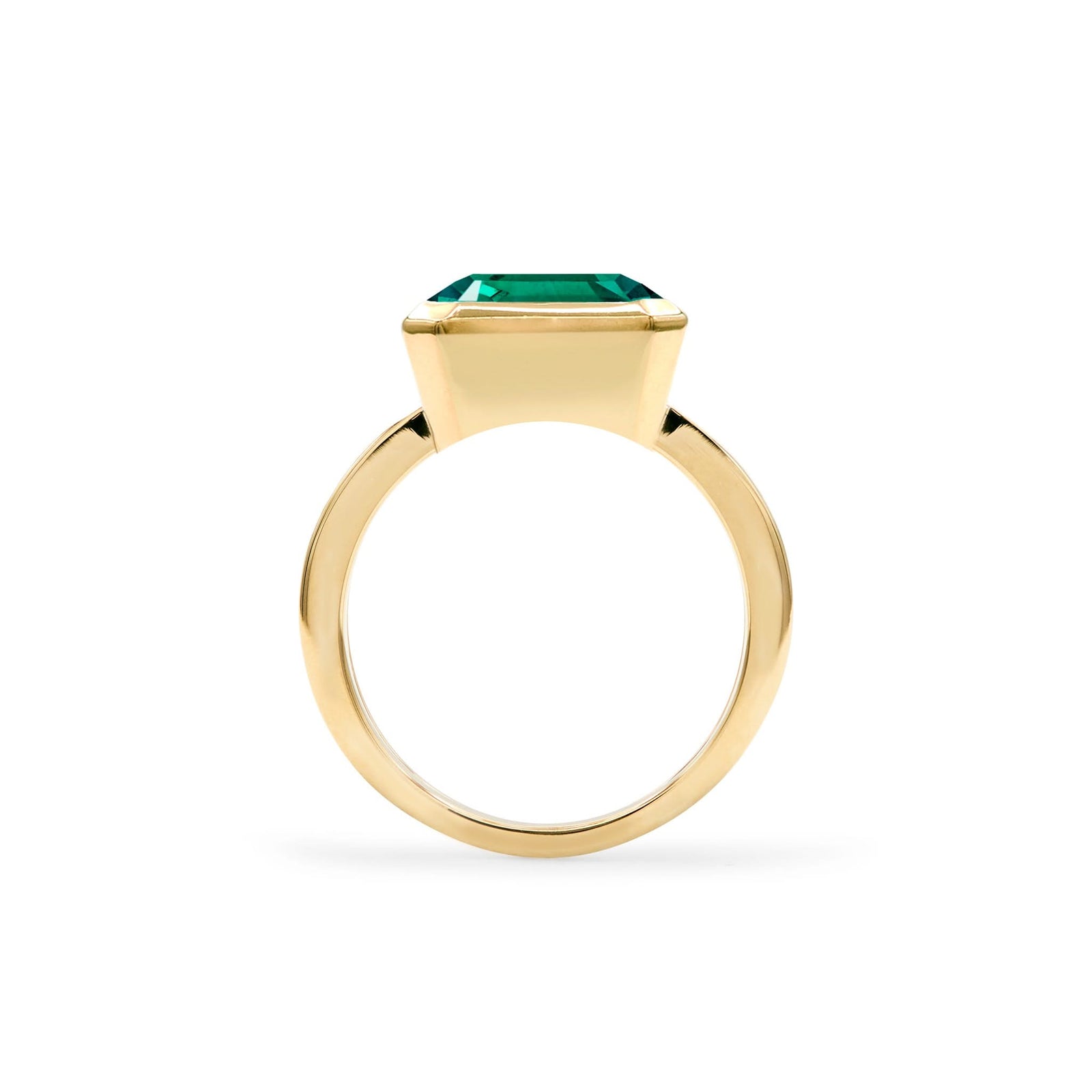 Warren Horizontal Emerald Ring, featuring an emerald-cut 8 x 10mm Emerald in 14k gold, hand-set horizontally in a 14k-gold bezel - standing view.
