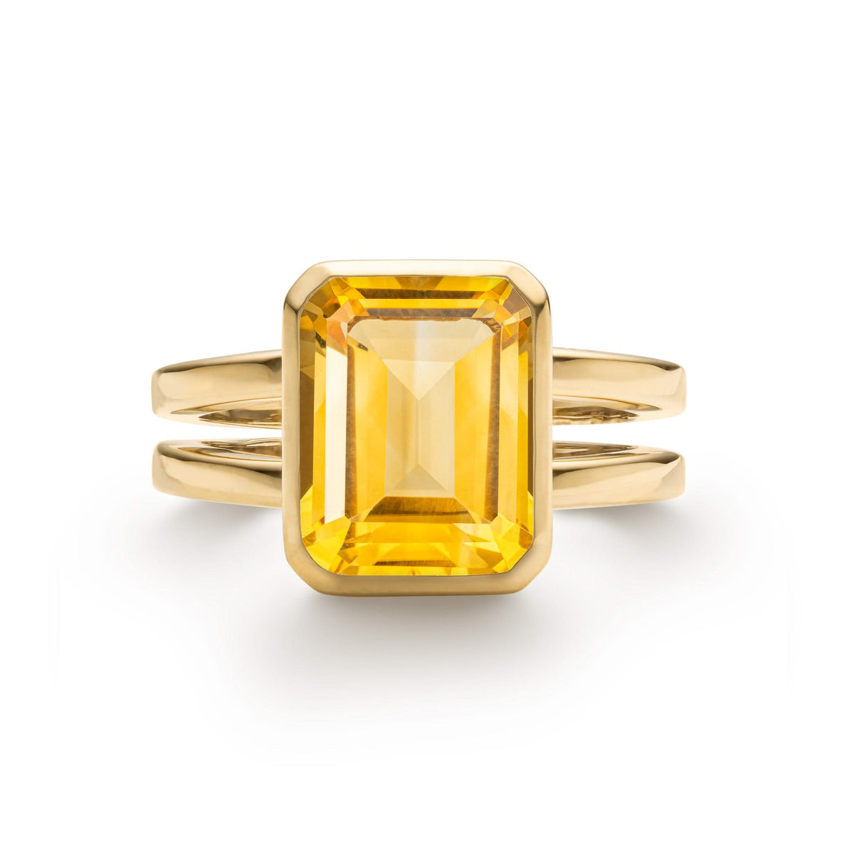 Warren ring in 14k yellow gold featuring one 10 x 8 mm emerald cut bezel set citrine - front view