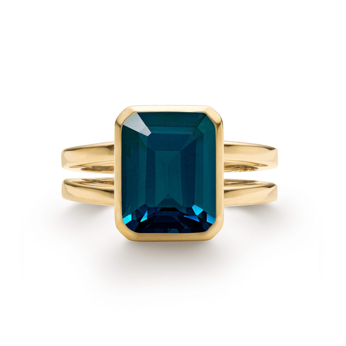 Warren Vertical Atlantic Blue Topaz Ring, featuring one 10 x 8 mm emerald cut, bezel set Atlantic Blue Topaz in 14k Gold - front view.