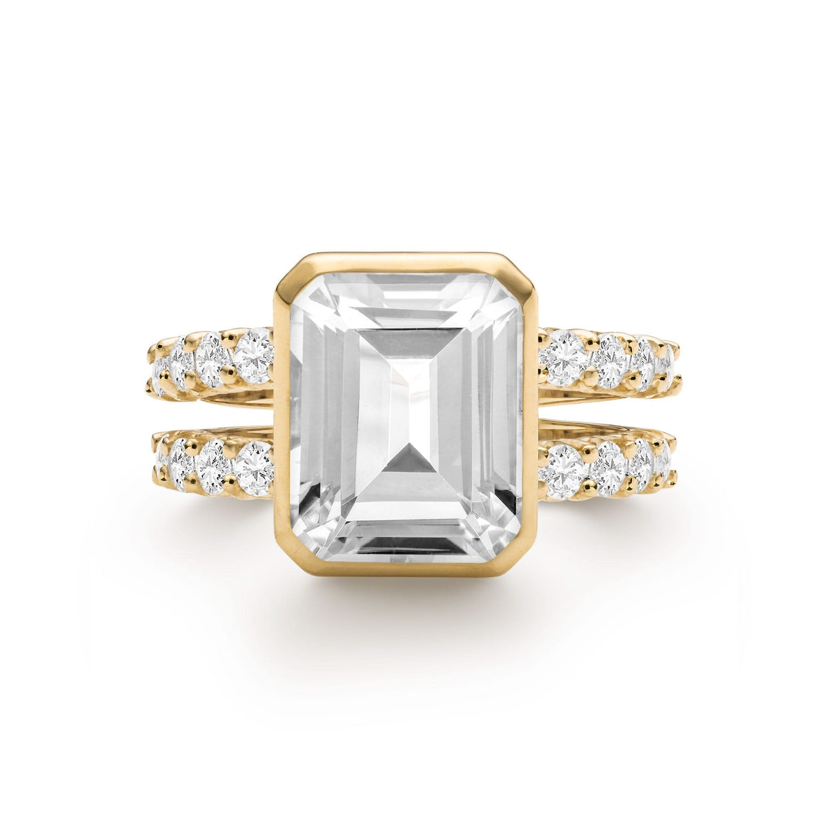 Warren ring in 14k yellow gold with accent diamonds featuring one 10 x 8 mm emerald cut bezel set white topaz - front view