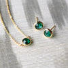 Grand 14k yellow gold cable chain necklace and stud earrings featuring 6 mm briolette cut bezel set emeralds