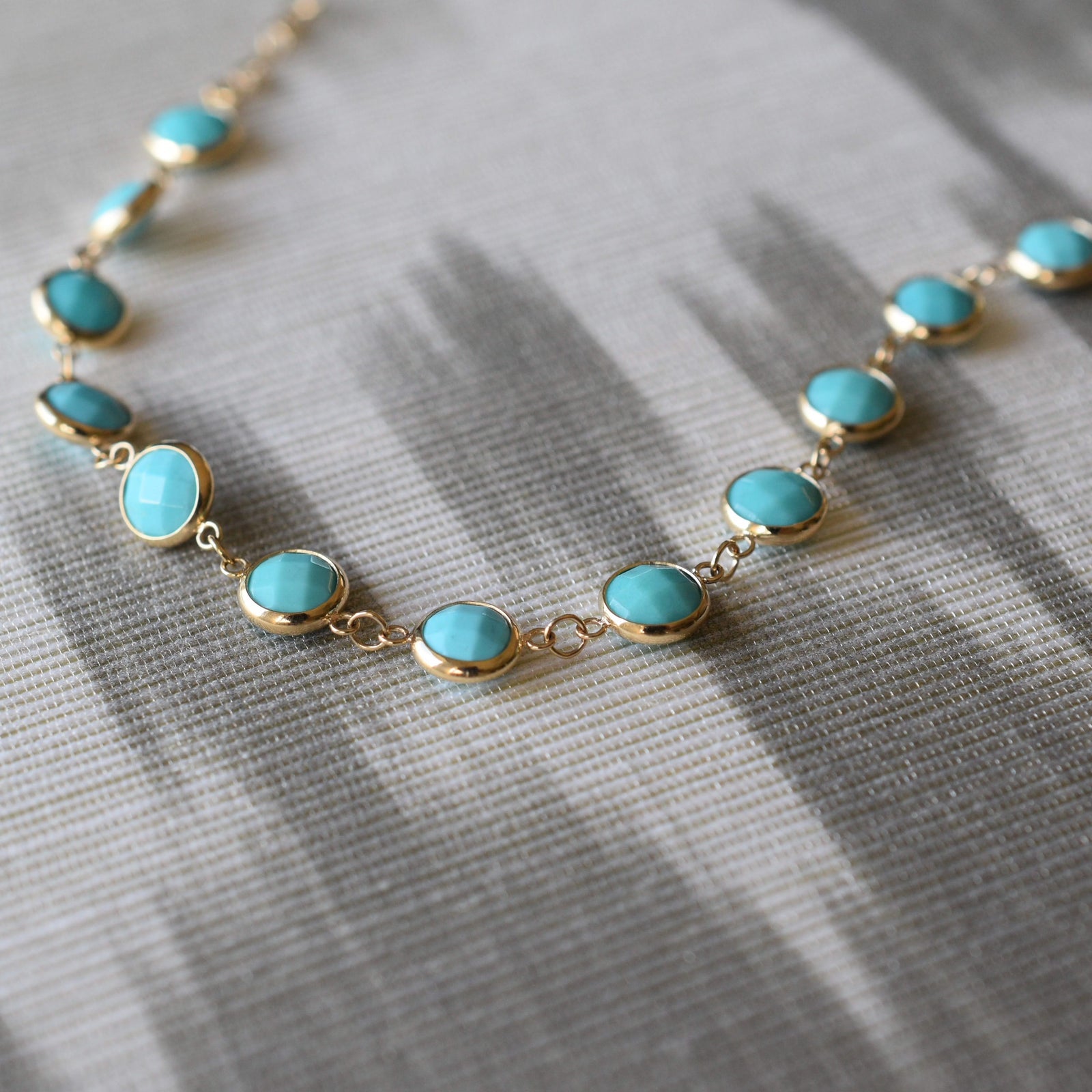 Newport Grand 14k yellow gold bracelet featuring 6 mm briolette cut bezel set turquoises