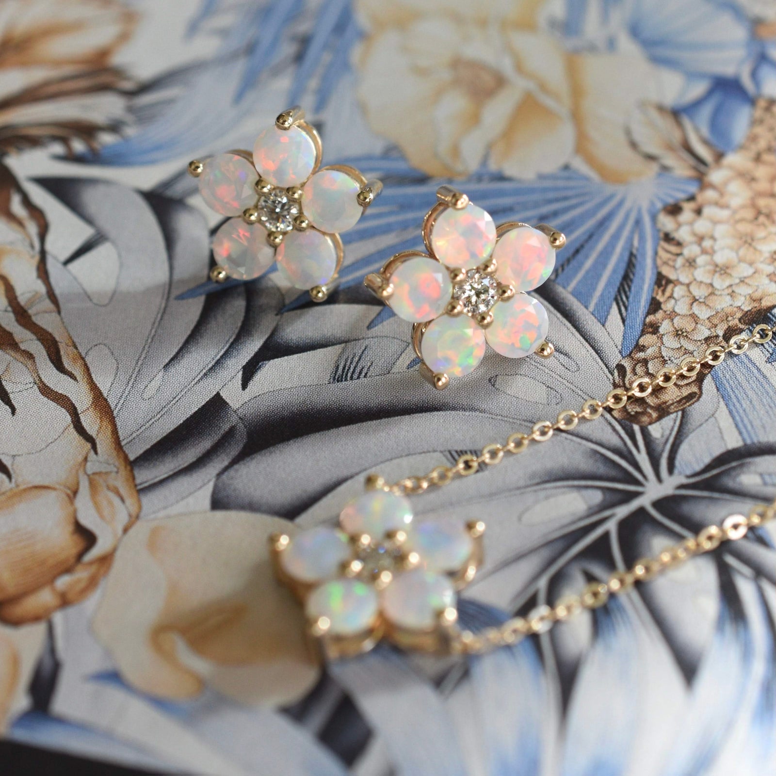 Pair of Greenwich earrings and a necklace in 14k yellow gold featuring 4 mm faceted round cut opals and 2.1 mm diamonds