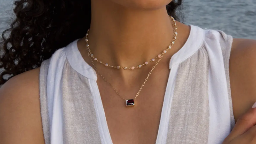 A Model Wearing A Garnet Necklace