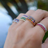 Woman's hand wearing multiple HAVERHILL Rosecliff birthstone stackable rings