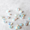 Opal gemstones on a white background