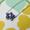 Haverhill Greenwich Flower necklace with September birthstone sapphire and diamond in 14k gold.