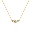 Barrington 3 Stone Necklace featuring a 4 mm round cut Aquamarine center stone framed by two 2 mm round cut Diamonds bezel set in 14k yellow gold on a saffron chain – front view.