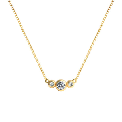 Barrington 3 Stone Necklace featuring a 4 mm round cut Diamond center stone framed by two 2 mm round cut Diamonds bezel set in 14k yellow gold on a saffron chain – front view.