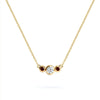 Barrington 3 Stone Necklace featuring a 4 mm round cut Diamond center stone framed by two 2 mm round cut Garnets bezel set in 14k yellow gold on a saffron chain – front view