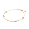 Pink Awareness Bracelet featuring five alternating 4 mm Pink Sapphires and Moonstones bezel set in 14k gold - angled view
