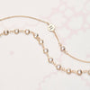 Personalized 1 Letter & 1 Petite White Topaz Necklace in 14k Gold (April)