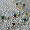Two rows of a personalized Newport necklace featuring the same alternating five gemstone pattern in 14k yellow gold.