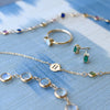 Greenwich Solitaire Opal & Diamond ring, Providence Emerald stud earrings, & a personalized 1 Letter & 1 Birthstone bracelet.