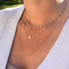 Woman wearing a Newport Moonstone necklace, a personalized Classic 1 Letter & 4 Moonstone necklace, and a Mia necklace.