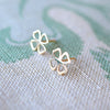 Pair of 14k yellow gold Clover Stud earrings featuring a 9.1mm cutout four-leaf clover.