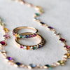 Two Rainbow Rosecliff Stackable rings, one featuring alternating diamonds, and a Rainbow Newport necklace in 14k yellow gold.
