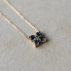 A Greenwich 4 Alexandrite & Diamond necklace in 14k yellow gold with a 1.17mm cable chain.
