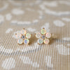 Pair of Greenwich Flower earrings, each featuring five 4mm sustainably grown opals and one 2.7mm diamond in 14k yellow gold.