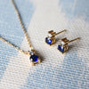Pair of Greenwich Solitaire earrings and Greenwich Solitaire necklace, each featuring one 4mm gemstone and one 2.1mm diamond.