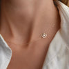 Woman wearing a 14k yellow gold Clover necklace featuring a 9.1mm four-leaf clover cutout on a 1.17mm cable chain.