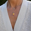 Warren Citrine pendant on an Adelaide Mini chain featuring a 10x8mm center stone, and a Rosecliff Small Circle necklace.