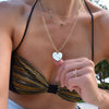 Woman wearing a 23x24.5mm Large Flat Heart Pendant engraved with 'A + H' on an 8.4x3.2mm paperclip link chain.