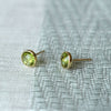 A pair of 14k yellow gold Grand stud earrings each featuring one 6 mm briolette cut peridot