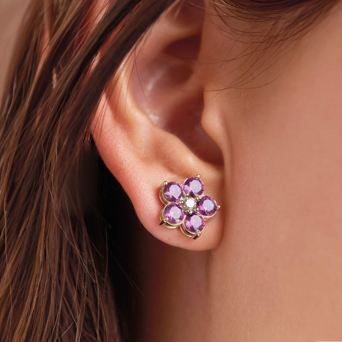 Earrings with six-petal flowers and good central tourmaline