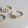 Jewelry including a Greenwich ring featuring one 4 mm faceted White Topaz and one 2.1 mm diamond prong set in 14k gold