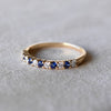 Rosecliff Stackable ring featuring eleven alternating 2mm faceted round cut diamonds and sapphires in 14k yellow gold.