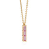 Providence Pink Sapphire vertical bar pendant featuring 3 petite baguette stones set in 14k yellow gold - angled view