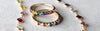 A Newport Rainbow necklace featuring 4mm gemstones and two Rosecliff Rainbow rings, one with alternating diamonds.