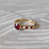 14k gold Rosecliff Grand Ring showcasing a 6 mm round, briolette-cut Ruby and eight alternating 2 mm round-cut Rubies and Diamonds.