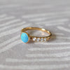 14k gold Rosecliff Grand Ring, featuring a 6 mm round, briolette-cut Turquoise and eight 2 mm round-cut Diamonds